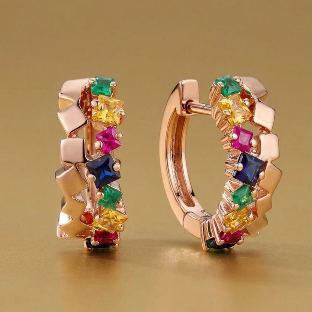 <div>Argollas en oro rosa con esmeraldas, zafiros y rubíes talla princesa. </div>